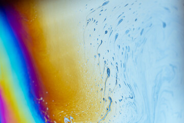 abstract colorful background with bubbles. Macro shot of rainbow on the soap bubbles 