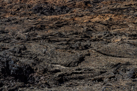 Background. Close-up. 'Malpais' - the rough, undulating surface of solidified lava.  Colorada volcano Lanzarote, Canary Islands, Spain