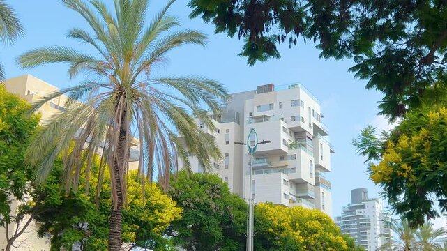 Original design of residential buildings. Israeli modern architecture. Stylish buildings with beautiful balconies, multi-storey buildings. Real estate in Israel