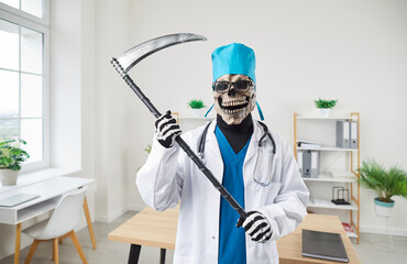 Portrait of a male doctor wearing Halloween grim reaper death costume in white uniform in scull...