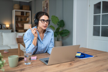 Fototapeta premium Telemedicine. Young woman doctor working at home office, private general practitioner, healthcare and medical female worker using laptop computer for contact with senior patients Helping people online