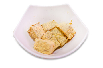 Top view of Japanese fresh warabi-mochi in white bowl, focus selective