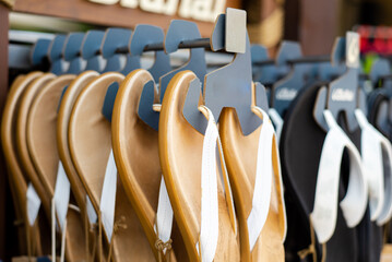 Leather toe post lady sandals with white deco-stitching strap on flip-flops display hangers of...