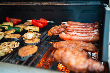 Ready Meat and Vegetables Barbecue Food Roasted over the Hot Glowing Ember Flames on a Grill Grate During Grill Season