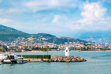 Panoramic view of old lighthouse in Alanya port. Landscape view of Mediterranean coast, Alanya, Turkey. High quality photo