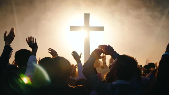 A congregation passionately worships beneath a glowing cross at a Christian gathering.