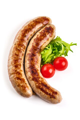 Grilled German pork sausages, Thuringer Rostbratwurst, close-up, isolated on white background.