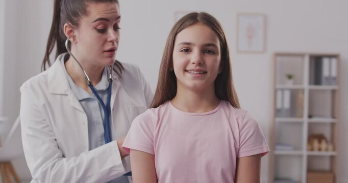 Pediatrician breath check, teen girl doctor visit, young women health care, female doctor stethoscope listening, consulting in clinic. Medical office care, kind health advice in adolescence developing