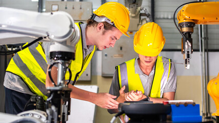 An engineer or technician got injury or accident while repairing robotic accident machine in...