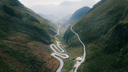 Aerial view of winding mountain road in South East Asia between Vietnam and Indonesia