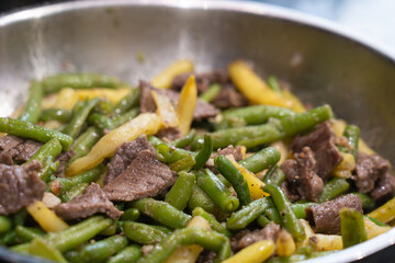 Stir Frying Beef with Green Yellow String Beans Closeup, Fried French Beans Mix with Meat, Asian Food
