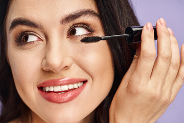 Woman enhancing her eyes with a mascara, adding a touch of elegance and allure.