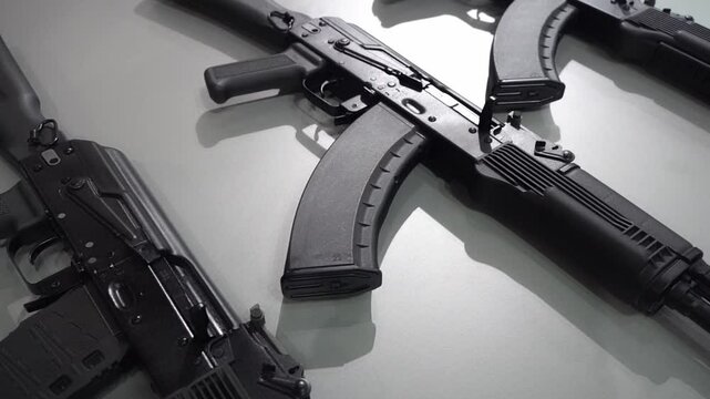 Machine guns and machine guns at a military weapons show. Black modern machine guns for the army and police. Arms trade concept. High quality FullHD footage
