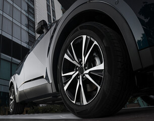 Car showroom. Aluminum wheel with Tire. automobile wheel tire. aluminium rims. Motor Corporation is...