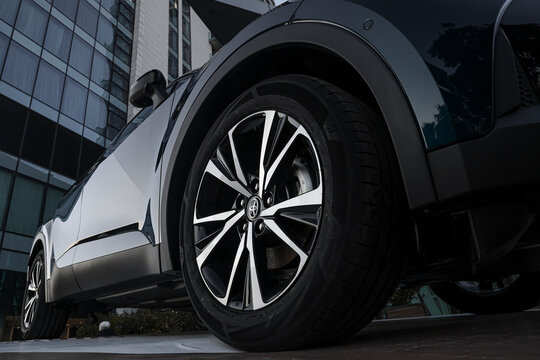 BATUMI, GEORGIA - MARCH 12, 2024: Car showroom. Aluminum wheel with Bridgestone turanza Tire. Toyota c-hr. automobile wheel tire. aluminium rims. Motor Corporation is Japanese automotive manufacturer.