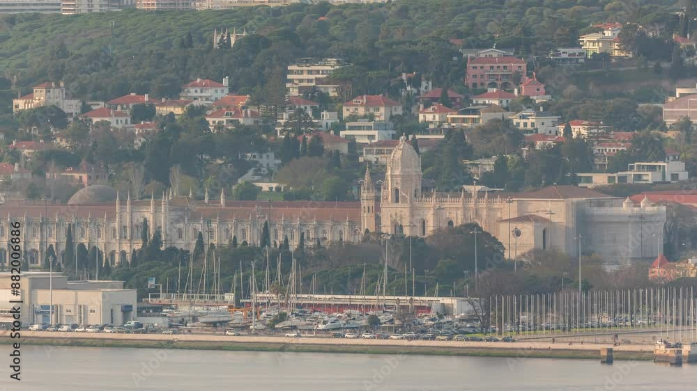 Wall mural lisbon cityscape with jeronimos monastery (or hieronymites) and emprie square and park timelapse. ae