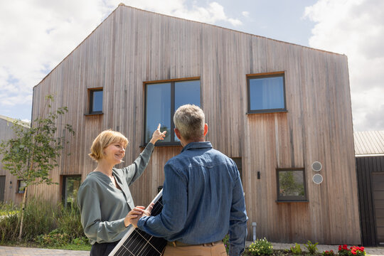 Eco conscious couple planning to install solar panels on their home