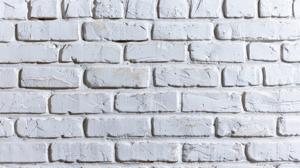 Fototapeta premium A white painted brick wall showing texture and pattern, perfect for backgrounds, wallpapers, or design inspirations.
