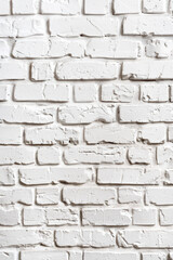 Obraz premium Close-up of a clean white brick wall texture, showing the natural pattern and detailed surface imperfections. Ideal for backgrounds and design projects.
