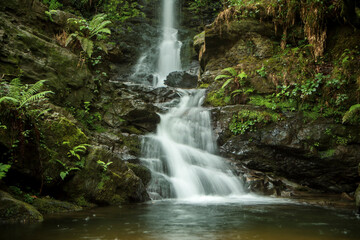 Fototapeta premium Detail of one of the spectacular Lamiña waterfalls, on the Barcenillas River, in Cantabria, Spain, with long exposure