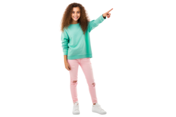Full body portrait of a delightful young girl pointing to the left standing confidently in casual clothes and sneakers smiling brightly Isolated on white background