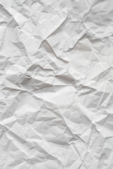 Obraz premium Crumpled white paper texture background. Perfect for design, texturing, and craft projects. High-resolution details reveal intricate folds and creases.
