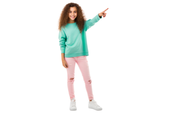 Full body portrait of a delightful young girl pointing to the left standing confidently in casual clothes and sneakers smiling brightly Isolated on white background