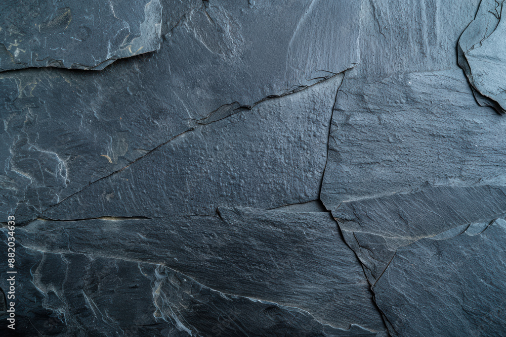 Poster close-up of dark shale rock texture with intricate natural patterns and cracks, perfect for backgrou