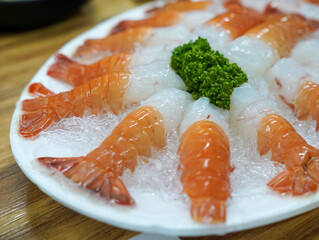 sushi on a plate, fresh red-banded lobster