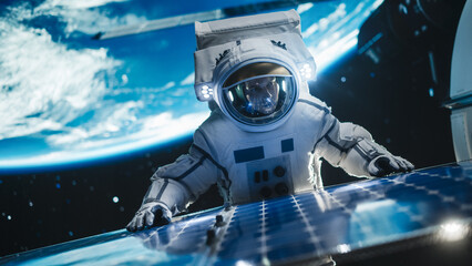 Astronaut on an Extravehicular Mission in Outer Space Far From Planet Earth. Courageous Man Fixing...