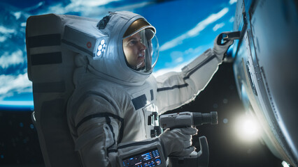 Portrait of Engineer Servicing a Panel on a Communication Satellite with an Automatic Screw Gun in Open Space. Professional Astronaut Working in Space with Beautiful Planet Earth in Background