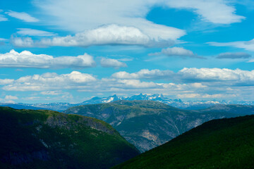 Naklejka premium View towards the Hurrungane Mountains from the Norwegian Scenic Route of the Aurlandsfjellet Mountains in June. View towards the Hurrungane Mountains.