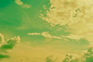 Fototapeta premium Vibrant Green and Yellow Sky With Fluffy Clouds on a Sunny Day
