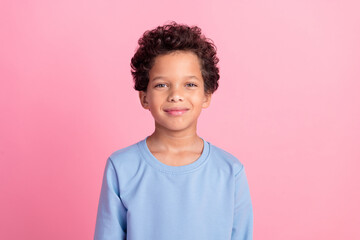 Photo of funky cool son dressed blue sweatshirt smiling emtpy space isolated pink color background