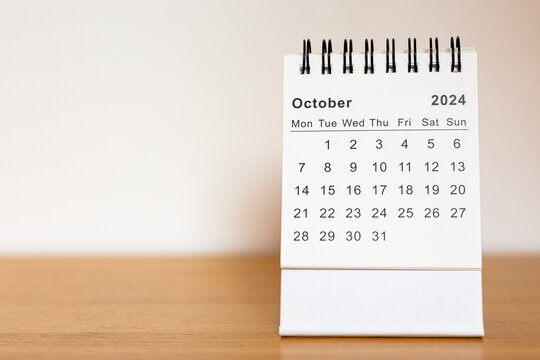 2024 calendar - October month page on the wooden desk