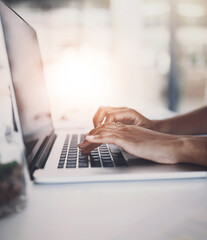 Hands, typing and laptop browsing in office, person and writing email or corporate business on...