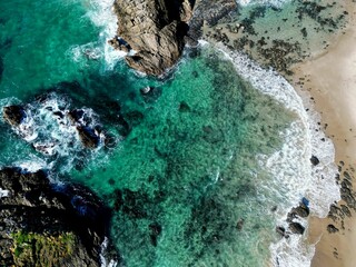 Aerial view of a beautiful beach with turquoise waters and rocks. New Zealand, Whangarei Heads