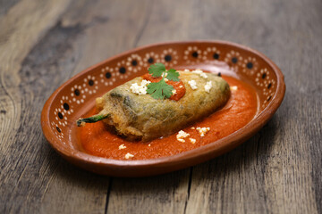 chile relleno (fried poblano pepper stuffed with minced meat and coated with egg meringue), Mexican...