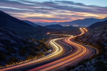 Light trails from tail lights on desert mountain road