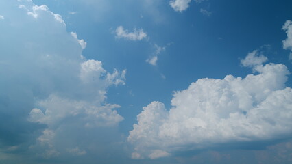 Fluffy cloud passing blue sky. Bubbling bubble of cumulous. Movement of cumulonimbus clouds in...
