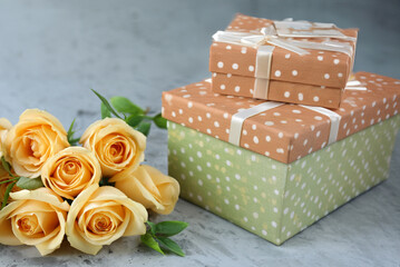 bouquet of roses and gift boxes for congratulations and holidays