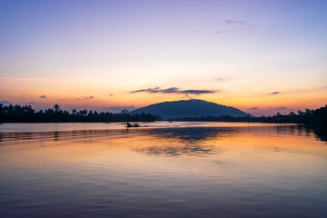 fisherman,s boat is sailing on the river in the morning