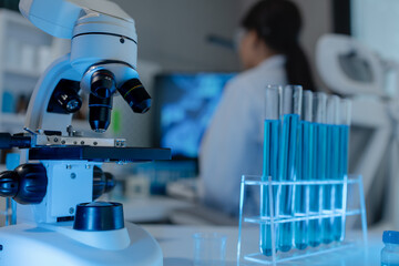 scientist is using microscope in laboratory, chemical researcher works in chemistry with concentration, chemist is conducting a science experiment using a microscope to test experimental substances