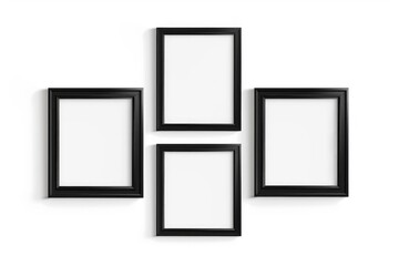 Four Black Picture Frames on White Wall