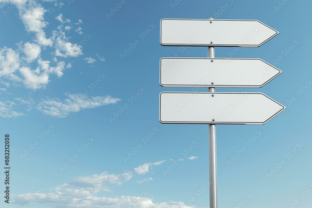 Poster the image shows three empty white road signs with arrows on a pole against a clear blue sky with som