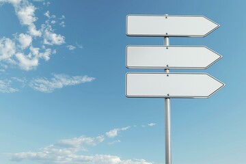 The image shows three empty white road signs with arrows on a pole against a clear blue sky with some clouds.