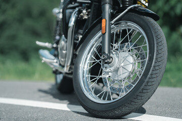 Motorcycle in a sunny motorbike on the road riding.with sunset light. copyspace for your individual text. classic motorcycle.	