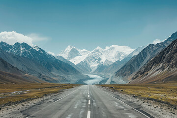 Fototapeta premium Highway Haven: An asphalt ribbon cuts through rugged mountains, leading adventurers on a scenic route through stunning valleys and ranges.