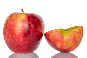 One half and one whole red apple, macro, isolated on white background.