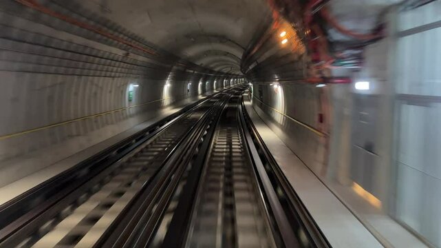 4K. Time lapse automatic train subway tunnel fast speed. Metro subway with a tunnel and a train moving fast. Tube lines in the tunnel. 4K.Time lapse automatic train subway tunnel fast speed
